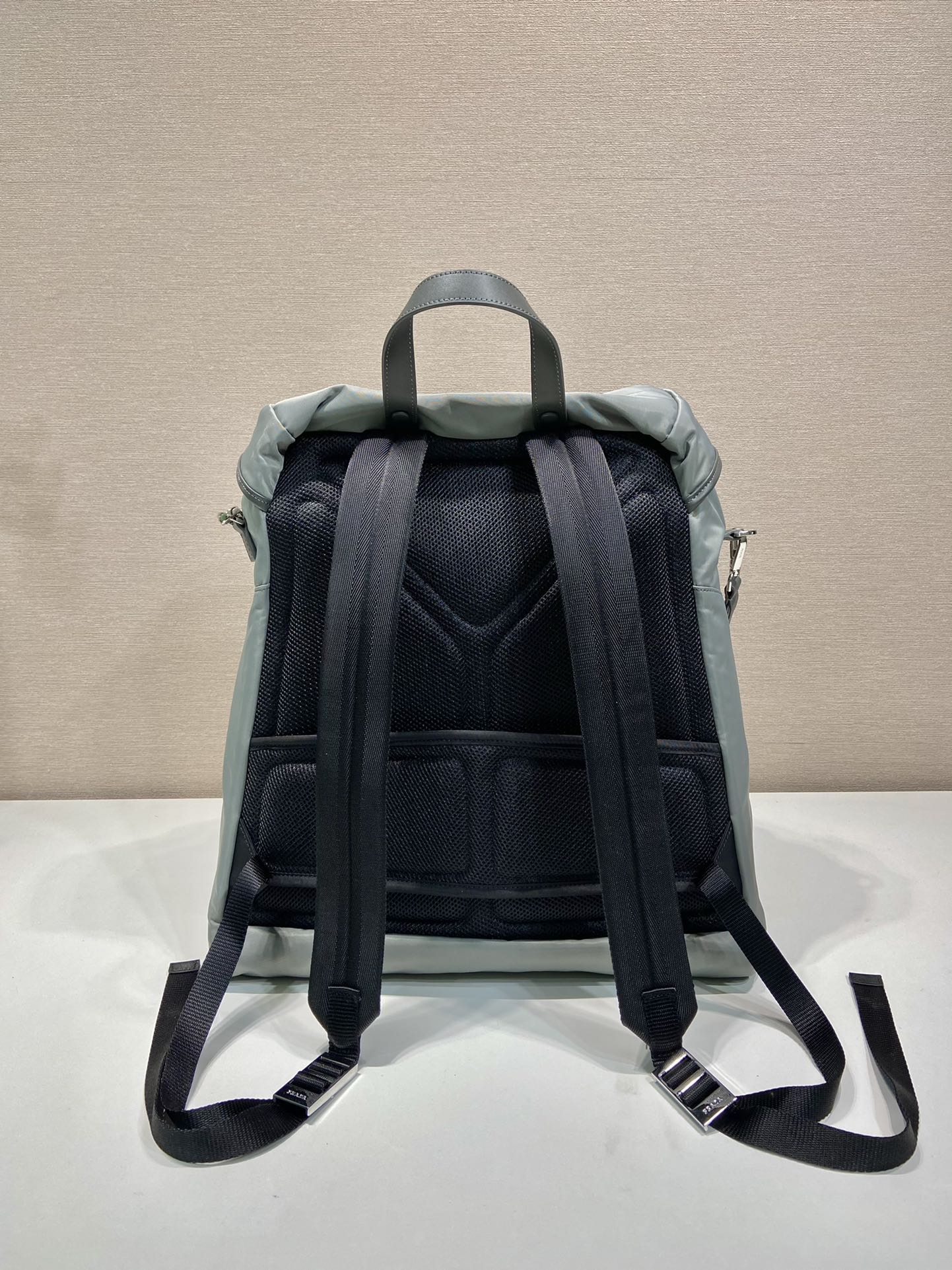 PRADA TRIANGLE LOGO BACKPACK 45 IN ASH GRAY RE-NYLON