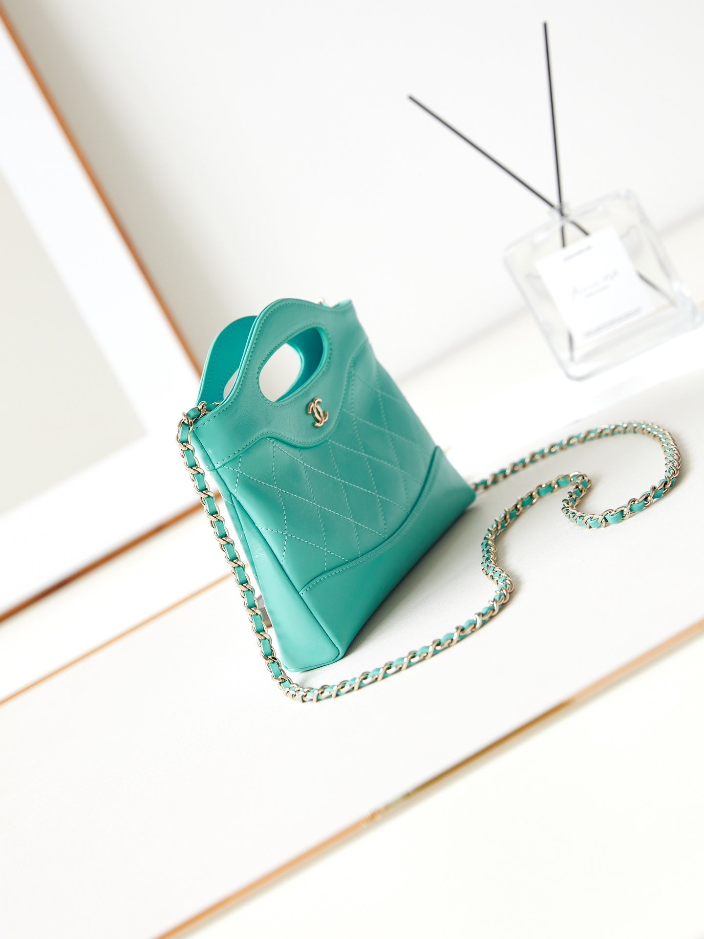 CHANEL 24s31 nano shopping bag 17.5cm cloud blue lambskin gold hardware