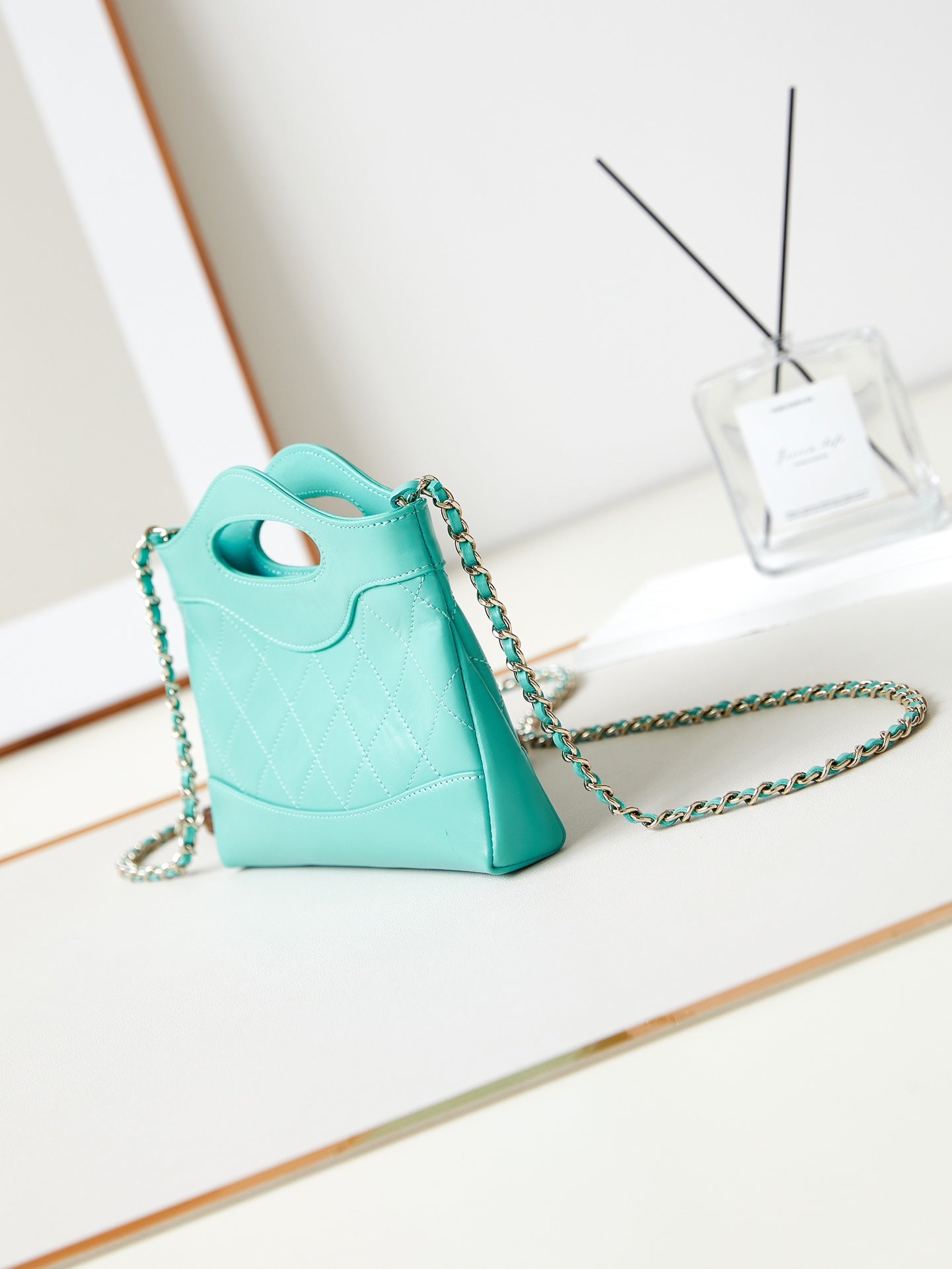 CHANEL 24s31 nano shopping bag 17.5cm cloud blue lambskin gold hardware