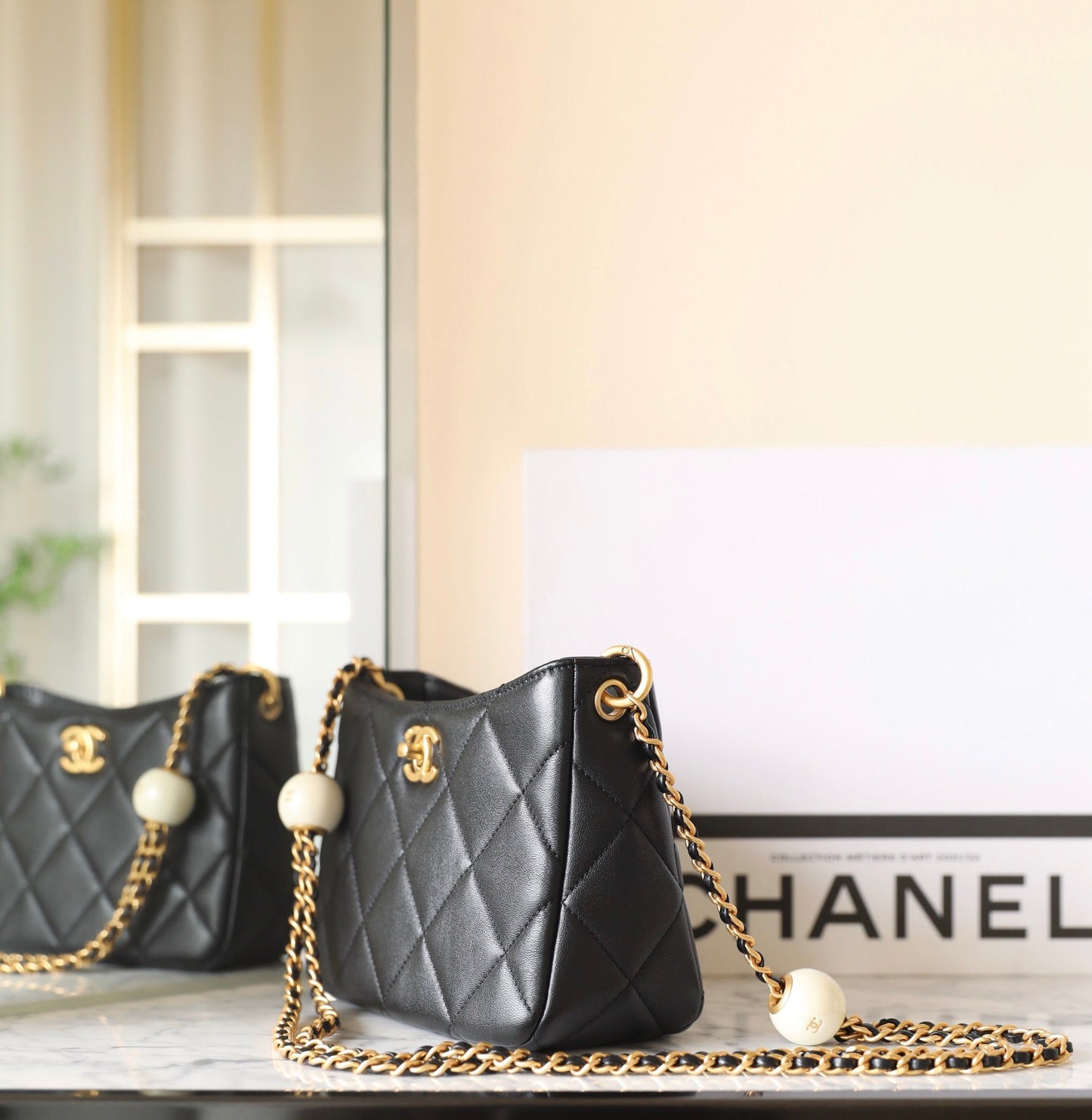 CHANEL 24s hobo bag 19cm black lambskin pearl ball