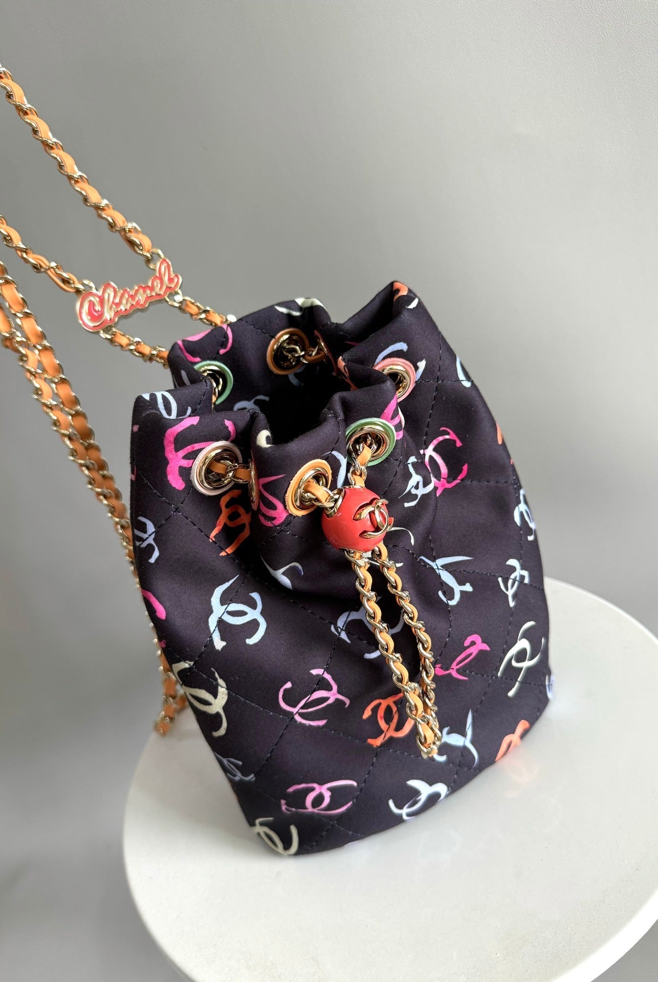 CHANEL BACKPACK 22CM BLACK & MANY OTHER COLORS PRINTED FABRIC GOLD HARDWARE