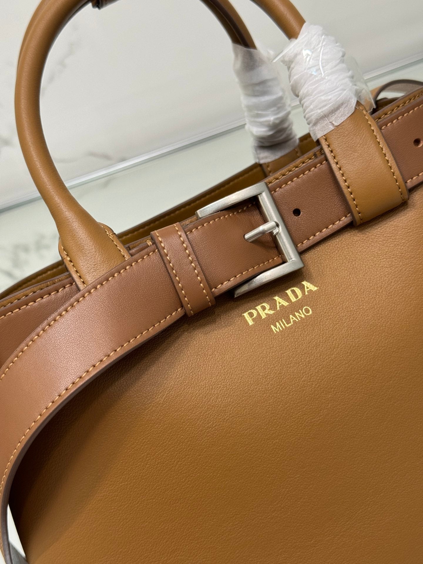 PRADA TOTE BAG WITH BELT 32 IN CIDER BROWN IMPORTED CALFSKIN