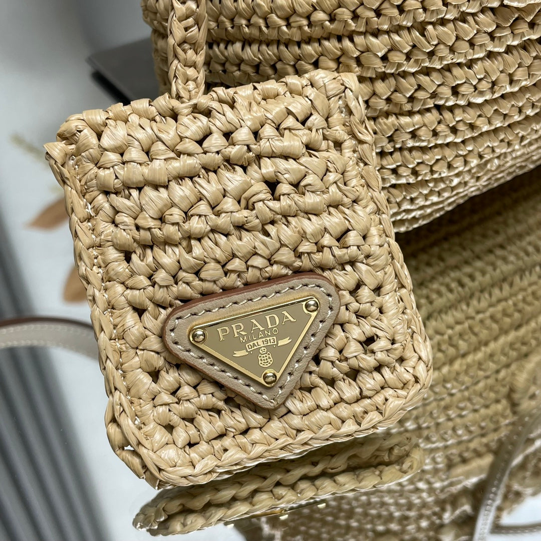 PRADA BUCKET BAG 20 IN BEIGE WOVEN RAFFIA EMBOSSED LOGO