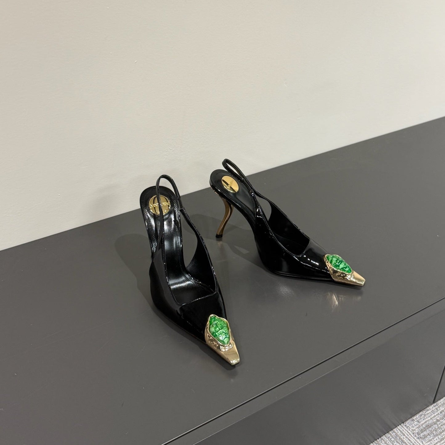 Saint Laurent GREEN GEM-STUDDED SLINGBACK PUMPS IN BLACK PATENT CALFSKIN