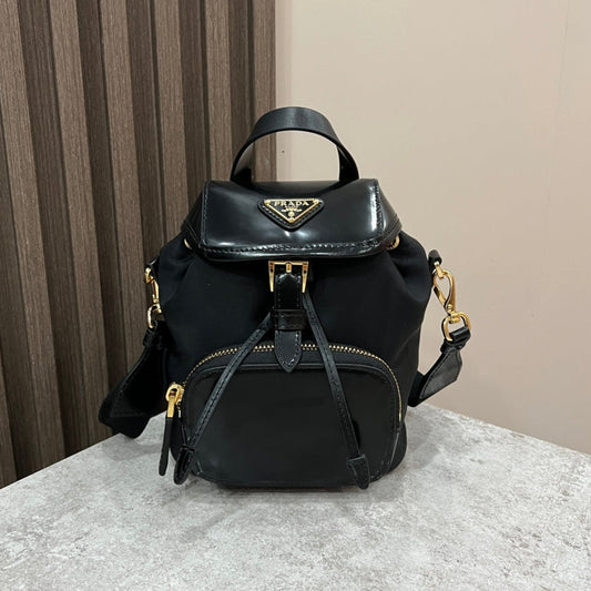 PRADA MINI BACKPACK 18 IN BLACK RE-NYLON AND GLOSSY CALFSKIN GOLD HARDWARE
