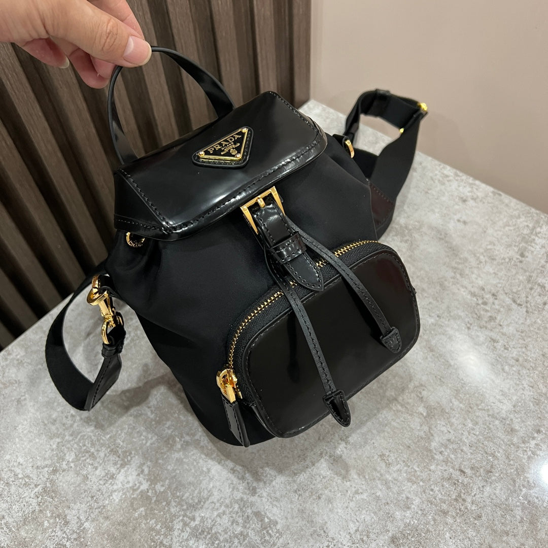 PRADA MINI BACKPACK 18 IN BLACK RE-NYLON AND GLOSSY CALFSKIN GOLD HARDWARE