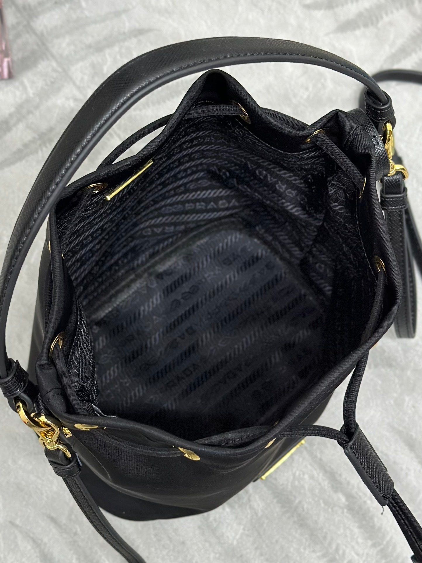 PRADA BUCKET BAG 19 IN BLACK RE-NYLON AND CALFSKIN HANDLE