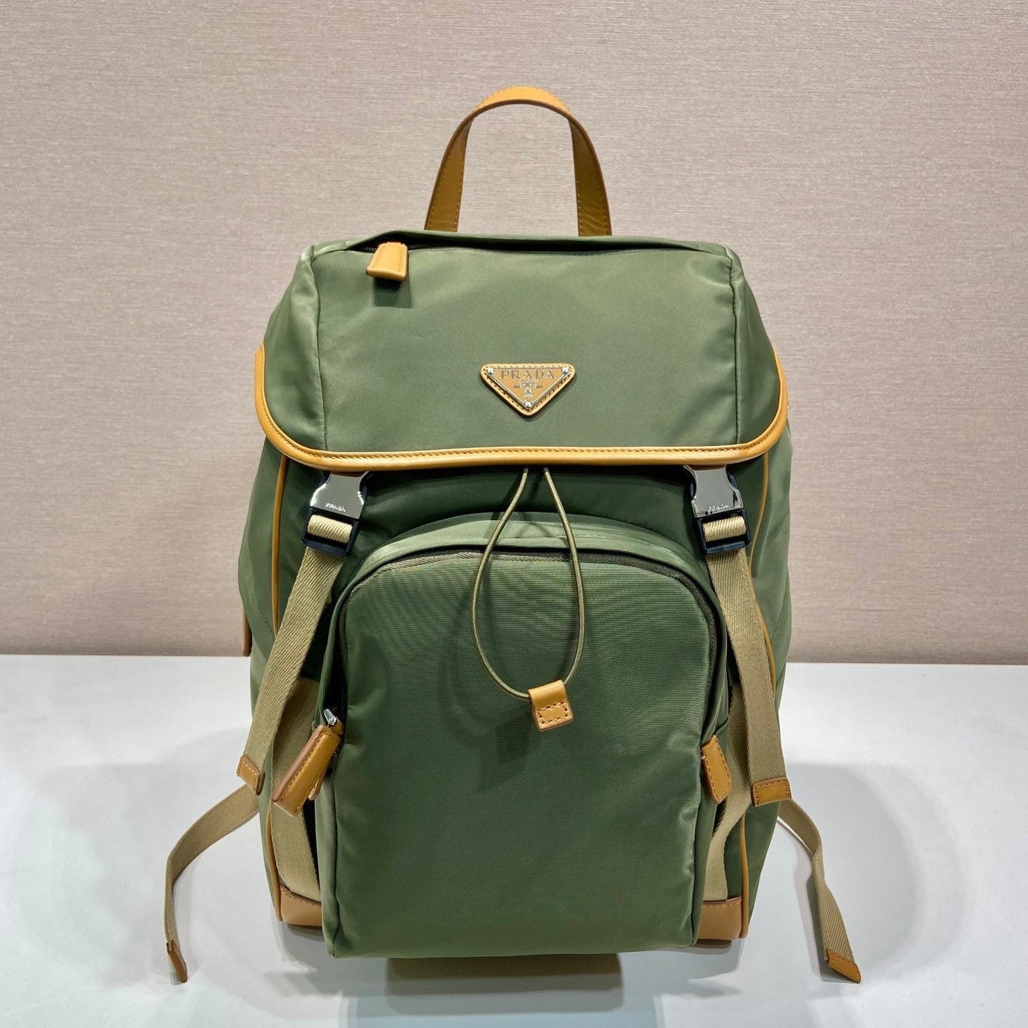 PRADA BACKPACK 45 IN SEAWEED GREEN RE-NYLON AND BROWN CALFSKIN TRIM