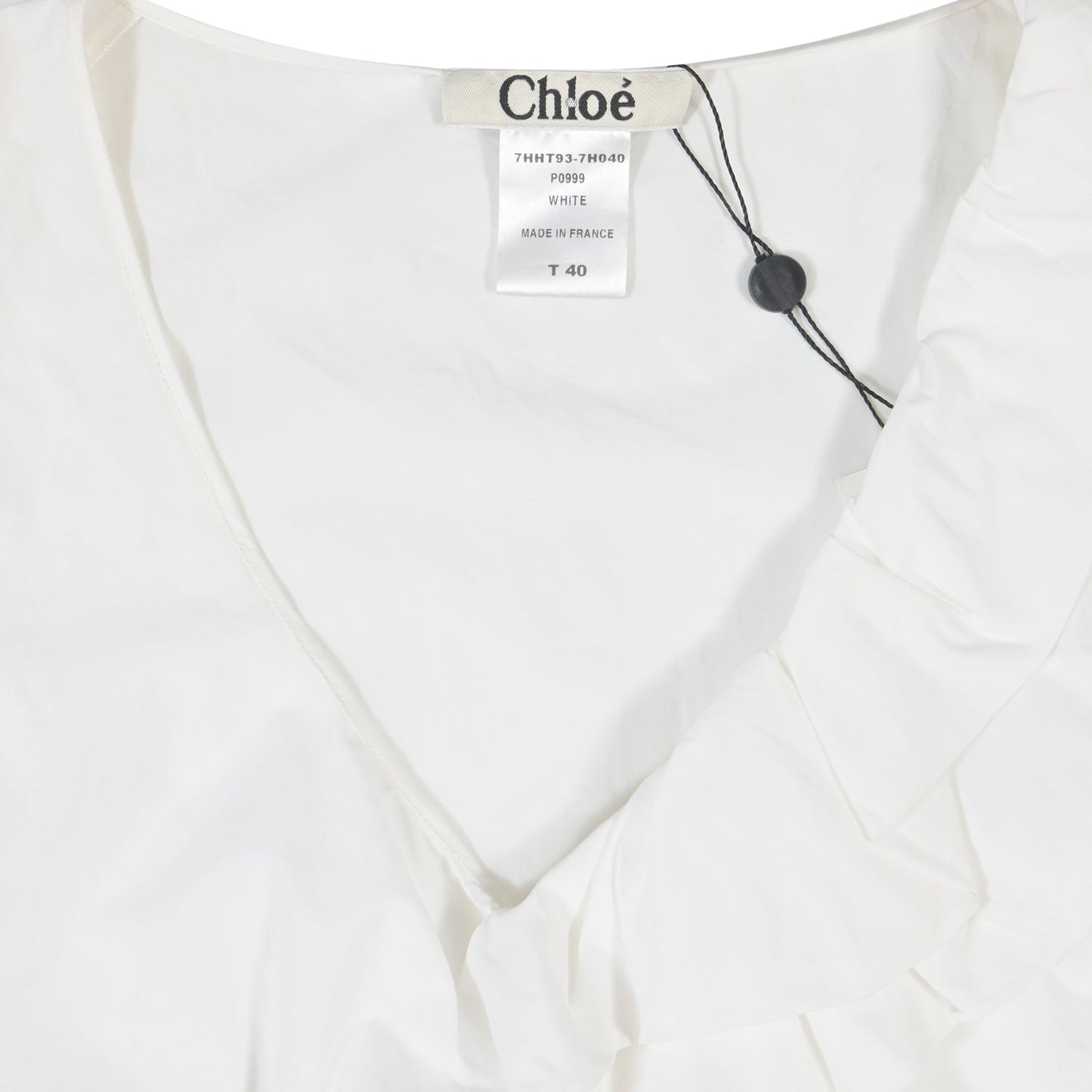 Chloe Sleeveless Ruffled Top in White Cotton