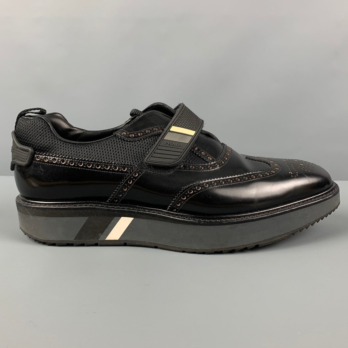 PRADA Size 11 Black Perforated Leather Wingtip Loafers
