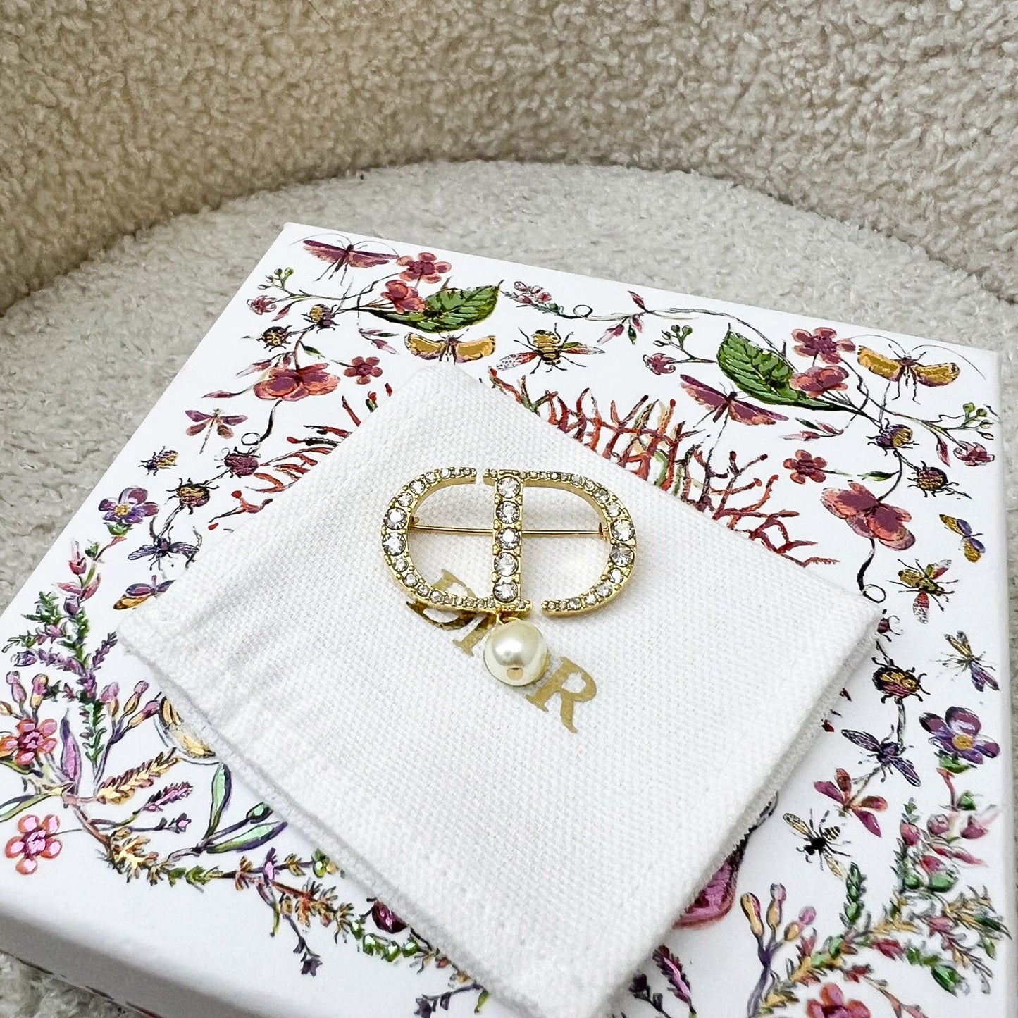 Dior Petit CD Brooch studded with Crystals and Dangling Pearl in Gold Tone HW