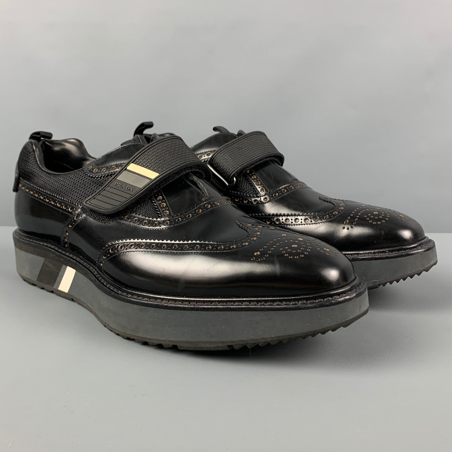 PRADA Size 11 Black Perforated Leather Wingtip Loafers
