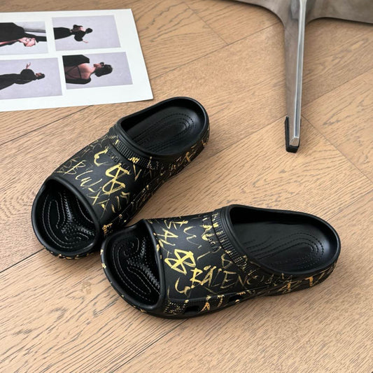 Balanciaga POOL GRAFFITI CROCS SLIDE SANDALS IN BLACK AND YELLOW RUBBER