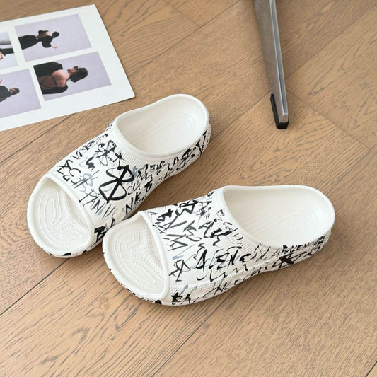 Balanciaga POOL GRAFFITI CROCS SLIDE SANDALS IN WHITE AND BLACK RUBBER