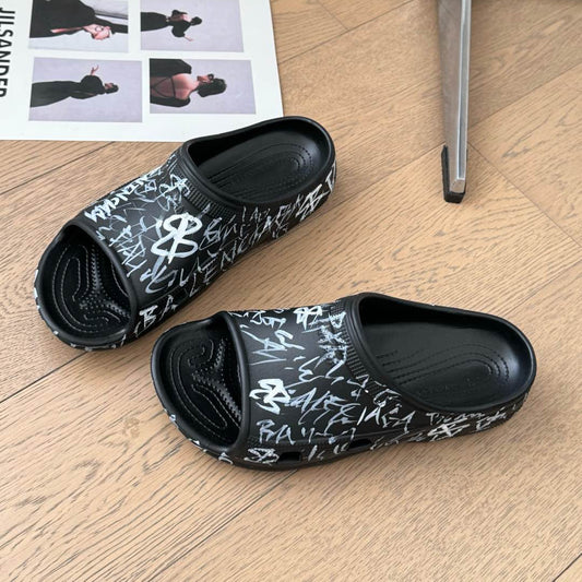 Balanciaga POOL GRAFFITI CROCS SLIDE SANDALS IN BLACK AND WHITE RUBBER