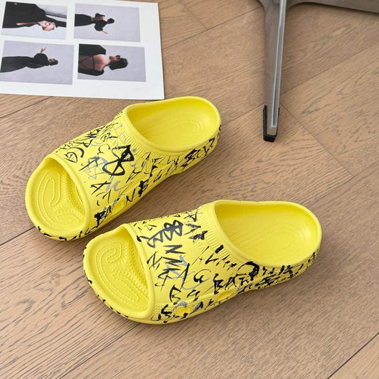 Balanciaga POOL GRAFFITI CROCS SLIDE SANDALS IN YELLOW AND BLACK RUBBER